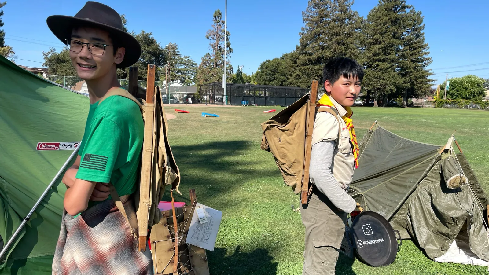 Scouts try on the first patented external frame pack system from the 1920s